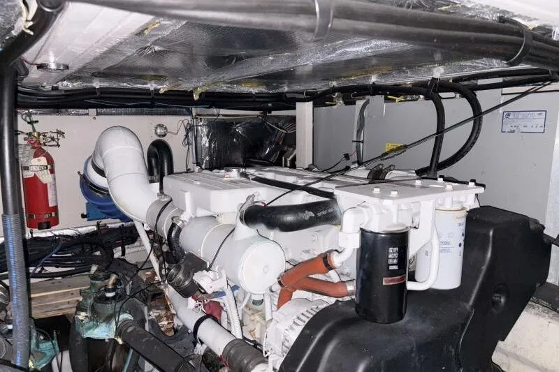 Inconspicuous Yacht Photos Pics Engine room of a 2006 Sea Ray 40 Motor Yacht with visible machinery and fire extinguisher.