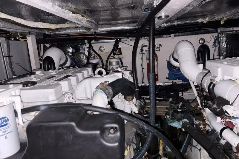 Inconspicuous Yacht Photos Pics Engine room of a 2006 Sea Ray 40 Motor Yacht, showcasing mechanical components and piping.