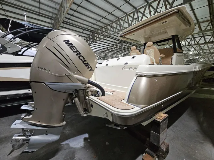 Yacht Photos Pics 2018 Chris-Craft 30 Catalina boat with Mercury Verado engine in storage facility.