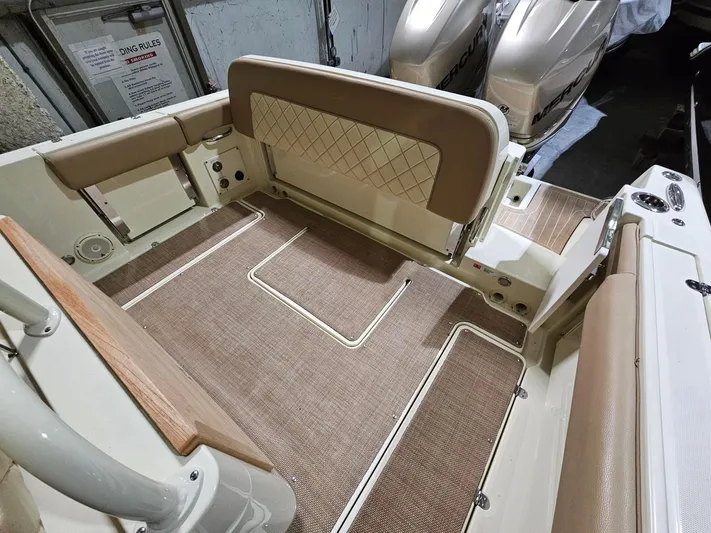  Yacht Photos Pics 2018 Chris-Craft 30 Catalina boat interior with beige seating and flooring.