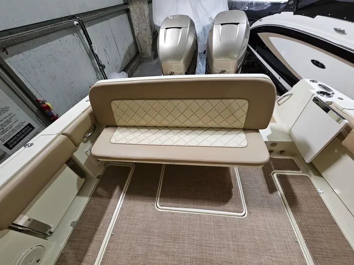  Yacht Photos Pics 2018 Chris-Craft 30 Catalina boat interior with beige seating and twin outboard engines.