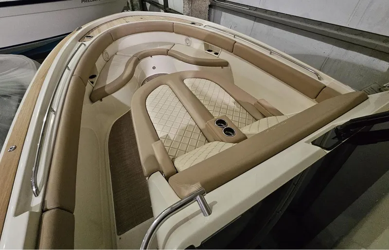  Yacht Photos Pics 2018 Chris-Craft 30 Catalina boat interior with beige seating and cup holders.