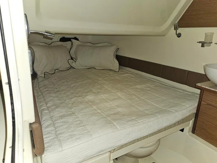  Yacht Photos Pics 2018 Chris-Craft 30 Catalina cabin interior with bed and pillows.