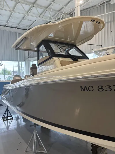  Yacht Photos Pics 2018 Chris-Craft 30 Catalina boat displayed indoors on stands.