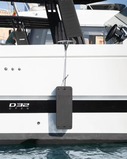  Yacht Photos Pics 2024 De Antonio Yachts D32 OPEN, sleek design, docked on water.