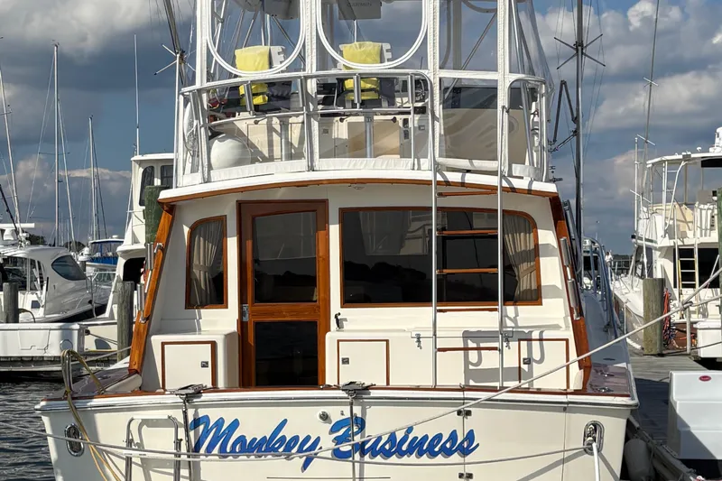 Monkey Business Yacht Photos Pics 1988 Egg Harbor 37 Convertible yacht named "Monkey Business" docked at a marina.