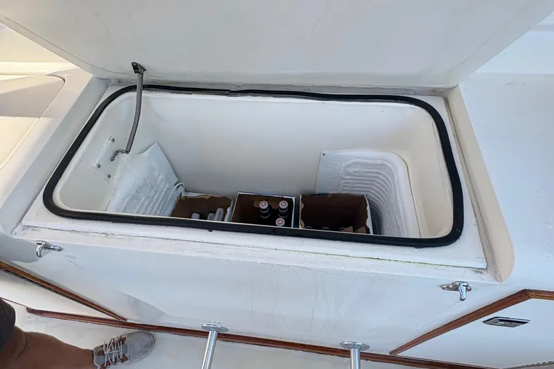 Monkey Business Yacht Photos Pics Open cooler on 1988 Egg Harbor 37 Convertible boat with drinks inside.