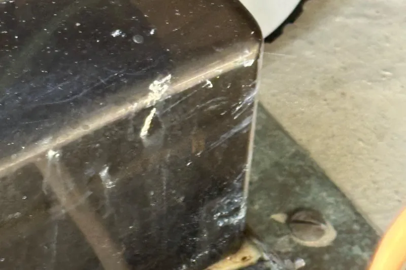 Monkey Business Yacht Photos Pics Close-up of a scratched surface on a 1988 Egg Harbor 37 Convertible boat.