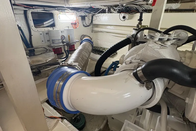 Monkey Business Yacht Photos Pics Engine room of 1988 Egg Harbor 37 Convertible with visible exhaust system and components.