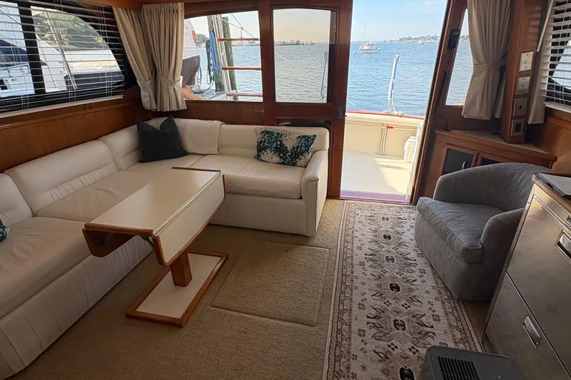 Monkey Business Yacht Photos Pics Interior of 1988 Egg Harbor 37 Convertible yacht with cozy seating and ocean view.