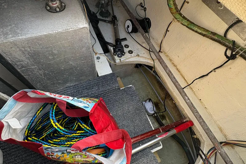 Monkey Business Yacht Photos Pics Interior of 1988 Egg Harbor 37 Convertible boat with ropes and equipment.