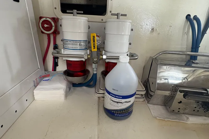 Monkey Business Yacht Photos Pics Engine room of 1988 Egg Harbor 37 Convertible with fuel filters and marine fluid.