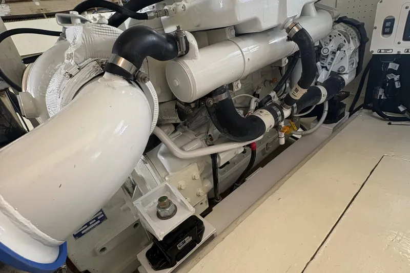 Monkey Business Yacht Photos Pics Engine room of 1988 Egg Harbor 37 Convertible boat, showcasing detailed machinery components.