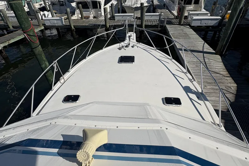 Monkey Business Yacht Photos Pics 1988 Egg Harbor 37 Convertible yacht docked at marina, view from bow.