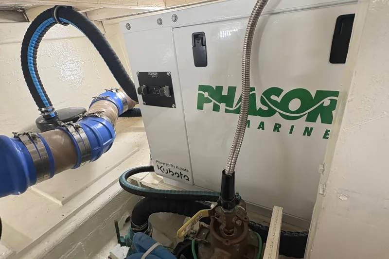 Monkey Business Yacht Photos Pics Engine room of 1988 Egg Harbor 37 Convertible with Phasor Marine generator.