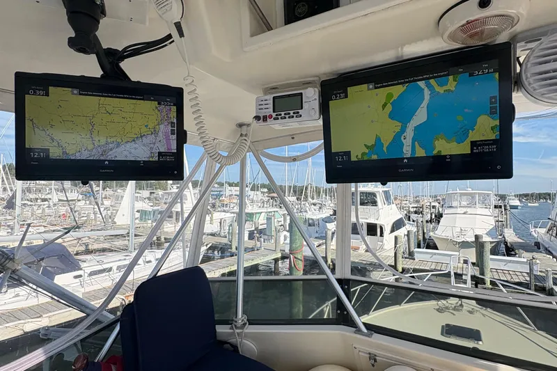 Monkey Business Yacht Photos Pics Cockpit view of 1988 Egg Harbor 37 Convertible with navigation screens at marina.