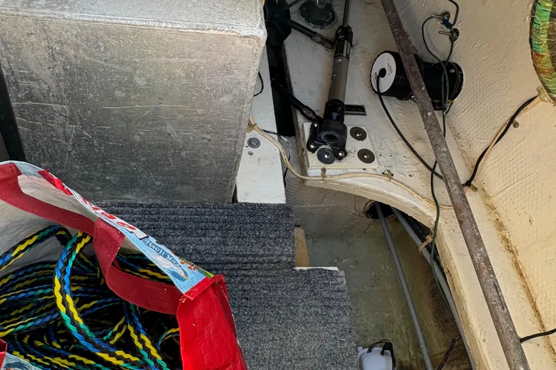 Monkey Business Yacht Photos Pics Interior view of 1988 Egg Harbor 37 Convertible boat with ropes and equipment.