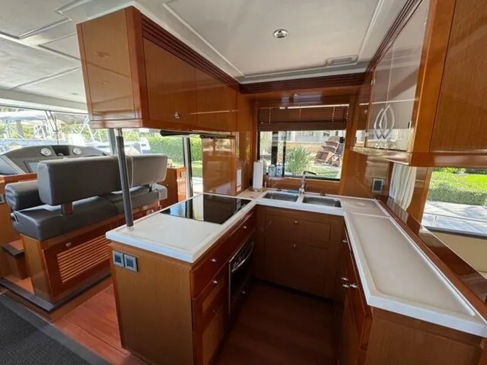 Candy Girl Yacht Photos Pics Interior of 2017 Beneteau Swift Trawler 50 with modern kitchen and seating area.