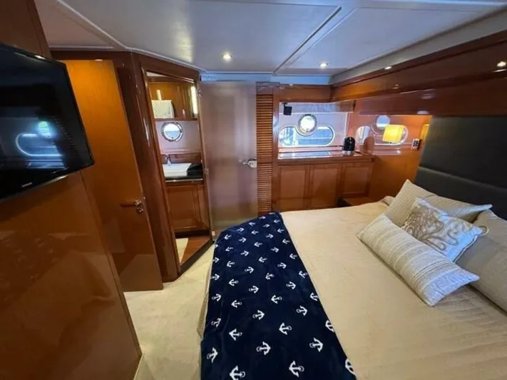 Candy Girl Yacht Photos Pics Luxurious cabin interior of 2017 Beneteau Swift Trawler 50 with elegant wood finishes.