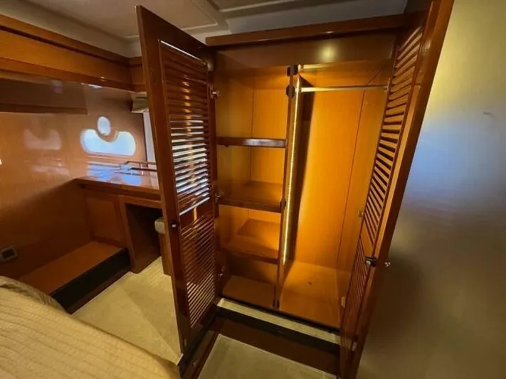 Candy Girl Yacht Photos Pics Luxurious wooden closet interior on 2017 Beneteau Swift Trawler 50 yacht.