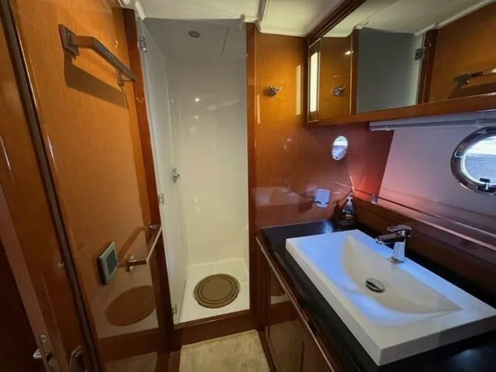 Candy Girl Yacht Photos Pics Luxurious bathroom in 2017 Beneteau Swift Trawler 50 with modern sink and shower.