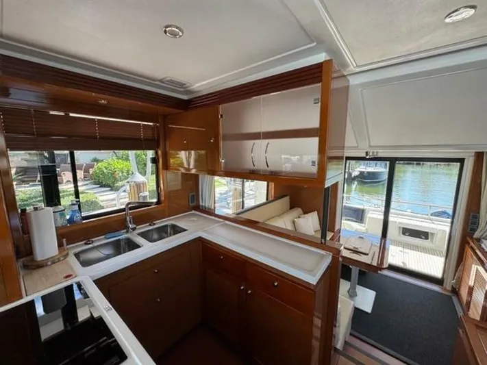 Candy Girl Yacht Photos Pics Interior of 2017 Beneteau Swift Trawler 50, featuring modern kitchen and spacious seating area.