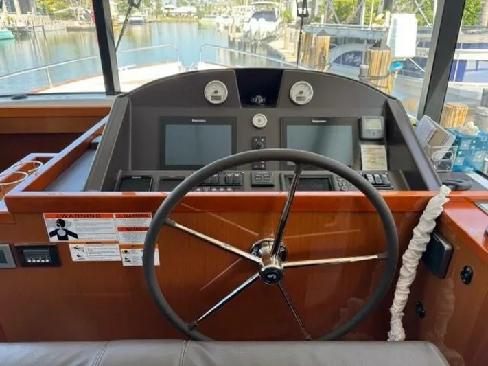 Candy Girl Yacht Photos Pics Helm of 2017 Beneteau Swift Trawler 50 with dual displays and steering wheel.