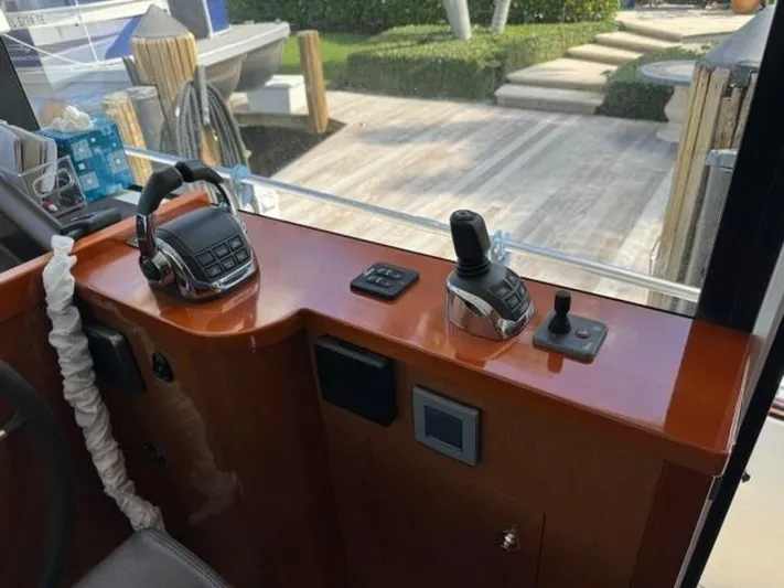 Candy Girl Yacht Photos Pics Control panel of a 2017 Beneteau Swift Trawler 50 with joystick and throttle.