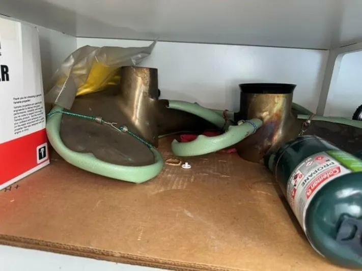 Candy Girl Yacht Photos Pics Storage shelf with marine equipment and a fire extinguisher on a Beneteau Swift Trawler 50.