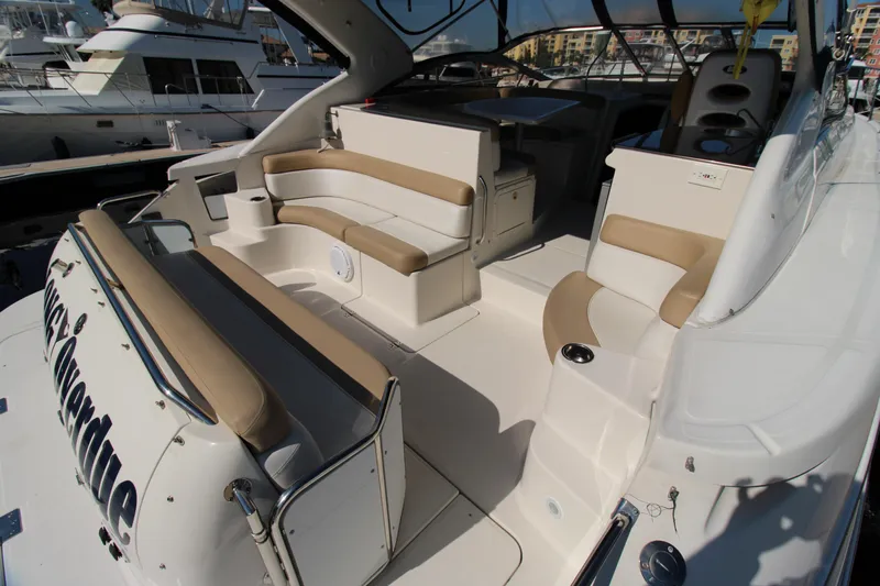 Long Overdue Yacht Photos Pics 2002 Regal Commodore 4260 yacht interior with beige seating and modern design.