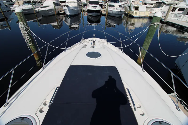 Long Overdue Yacht Photos Pics Bow view of 2002 Regal Commodore 4260 yacht docked at marina.