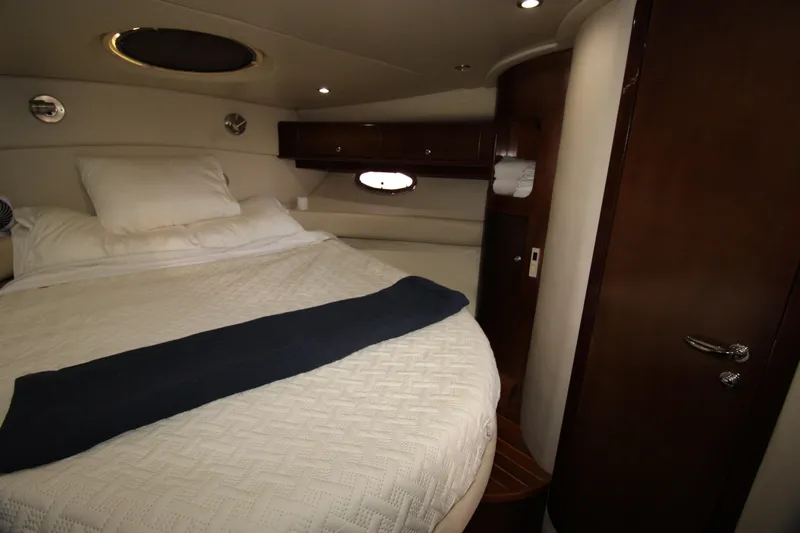 Long Overdue Yacht Photos Pics Luxurious cabin interior of 2002 Regal Commodore 4260 yacht with cozy bed.