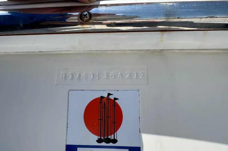 Long Overdue Yacht Photos Pics 2002 Regal Commodore 4260 boat hull identification number and logo detail.