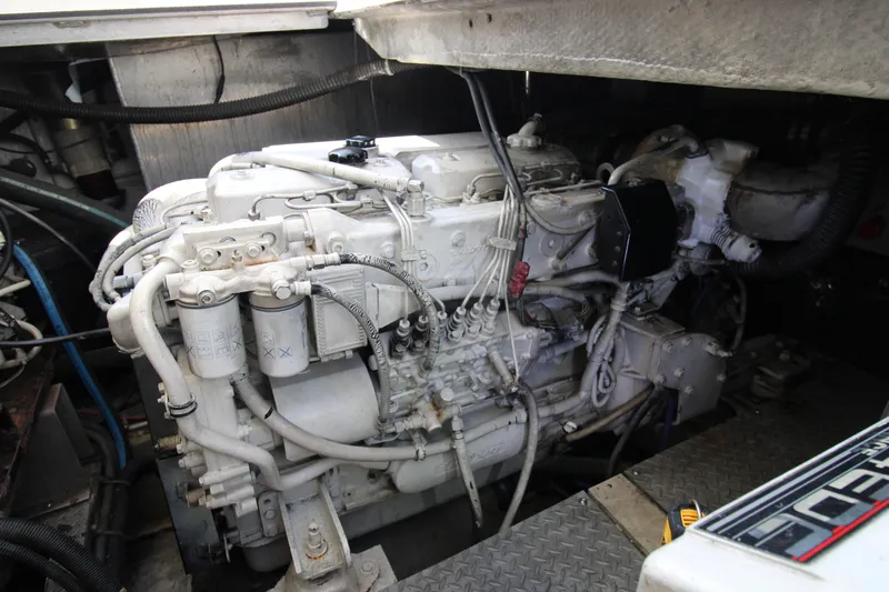 Long Overdue Yacht Photos Pics Engine compartment of a 2002 Regal Commodore 4260 boat, showcasing detailed machinery.