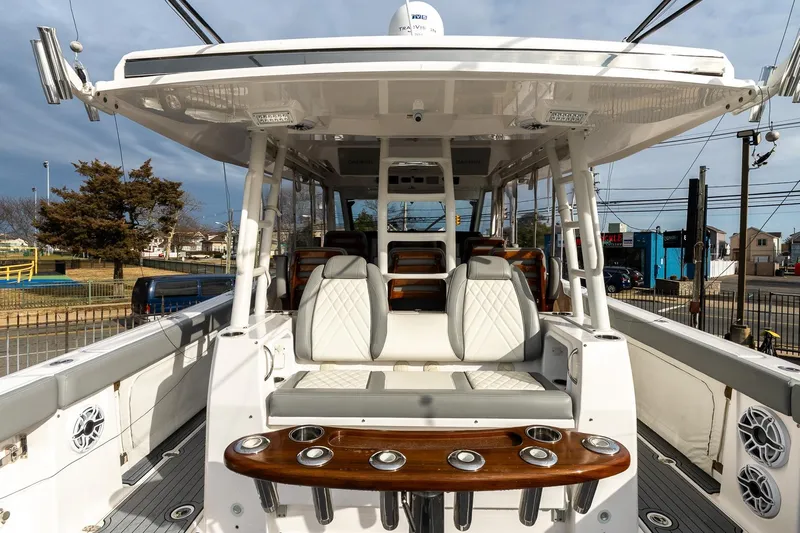 Montrachet Yacht Photos Pics 2023 Everglades 455 Center Console boat interior with luxurious seating and rod holders.