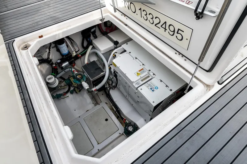 Montrachet Yacht Photos Pics 2023 Everglades 455 Center Console engine compartment with equipment and wiring.