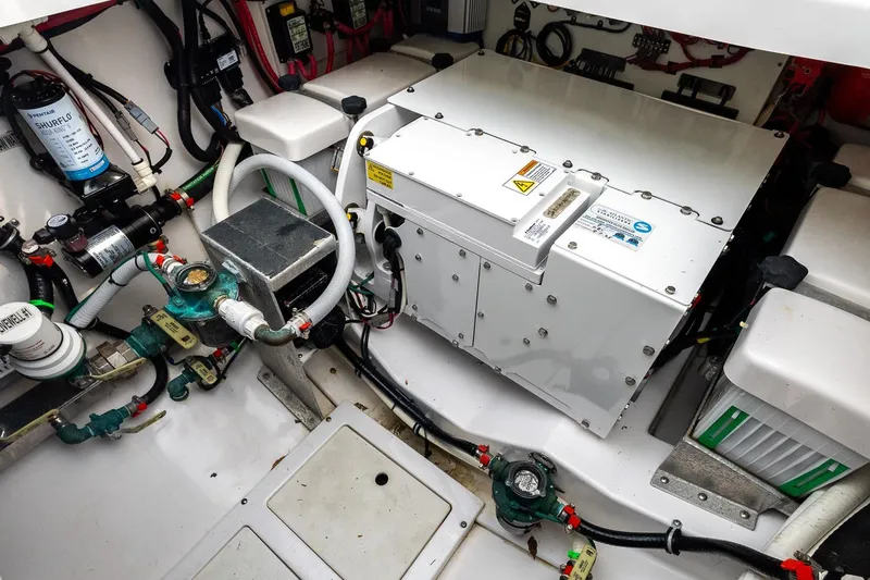 Montrachet Yacht Photos Pics 2023 Everglades 455 Center Console engine compartment with electrical components and wiring.