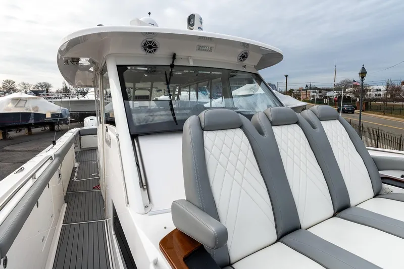 Montrachet Yacht Photos Pics 2023 Everglades 455 Center Console boat with sleek seating and modern design.