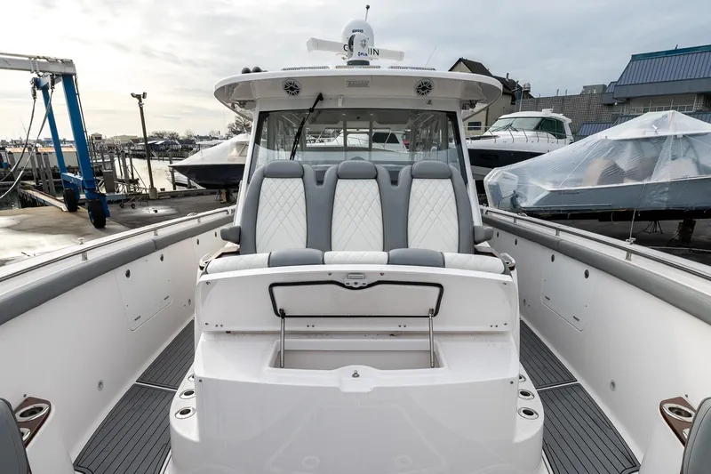 Montrachet Yacht Photos Pics 2023 Everglades 455 Center Console boat with sleek seating and modern design.