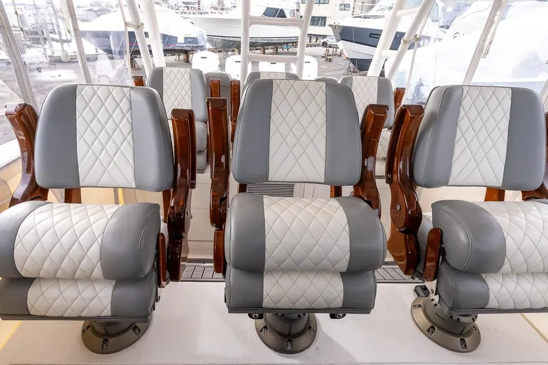 Montrachet Yacht Photos Pics Luxury seating on 2023 Everglades 455 Center Console boat, featuring quilted upholstery.