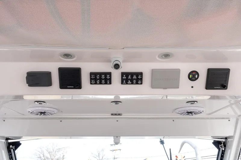 Montrachet Yacht Photos Pics 2023 Everglades 455 Center Console dashboard with control panels and speakers.