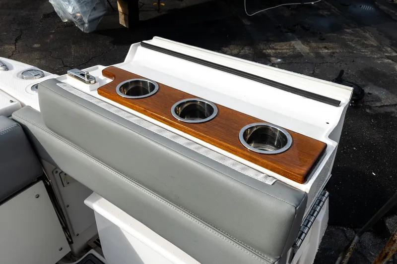 Montrachet Yacht Photos Pics 2023 Everglades 455 Center Console boat with wooden cup holders and cushioned seating.