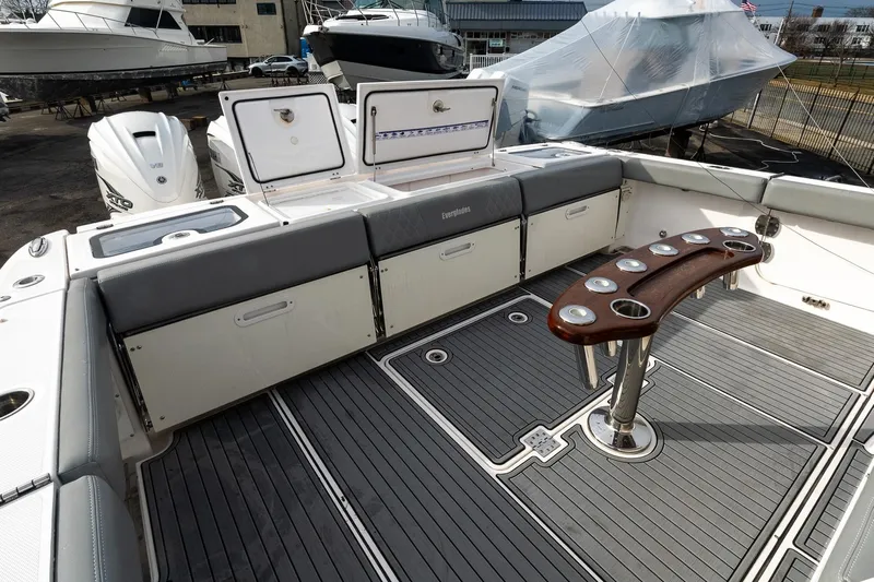 Montrachet Yacht Photos Pics 2023 Everglades 455 Center Console boat interior with seating and rod holders.