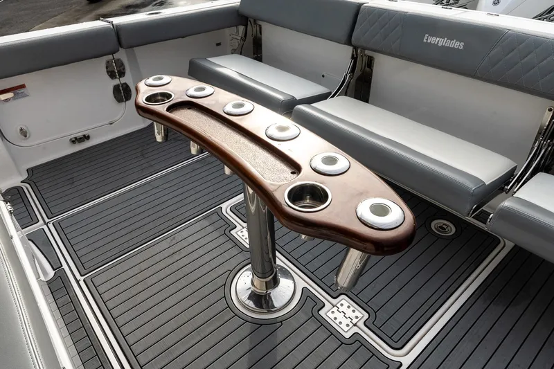 Montrachet Yacht Photos Pics 2023 Everglades 455 Center Console boat interior with seating and cup holders.