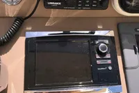 Control panel of a 1996 Maxi Custom Tender with radio and navigation equipment.