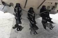 Propellers of a 1996 Maxi Custom Tender boat on display.