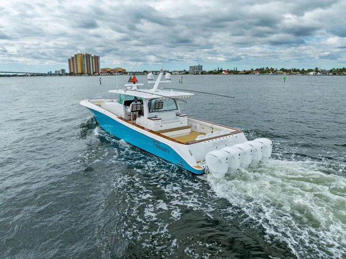 Da Dinghy Yacht Photos Pics 2021 HCB Estrella boat cruising on open water under cloudy skies.
