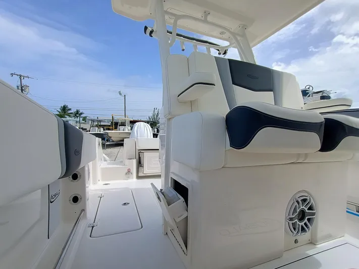 270-152 Yacht Photos Pics 2025 Robalo R270 Center Console boat interior with cushioned seating and speaker system.
