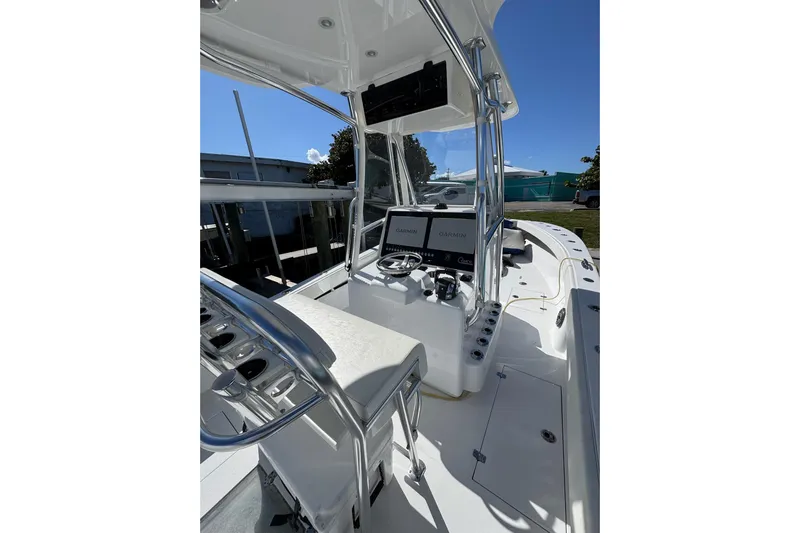  Yacht Photos Pics 2007 Conch 27 boat interior with modern navigation equipment and seating.