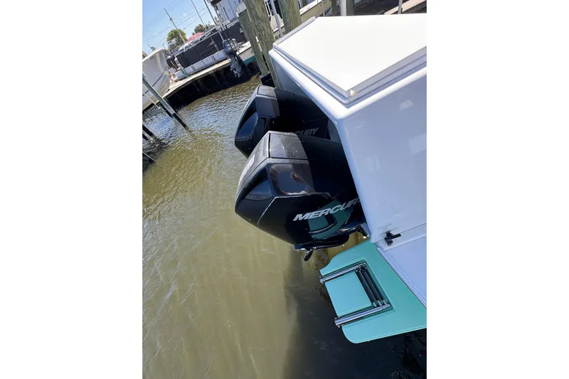  Yacht Photos Pics 2007 Conch 27 boat with dual Mercury outboard engines docked in marina.